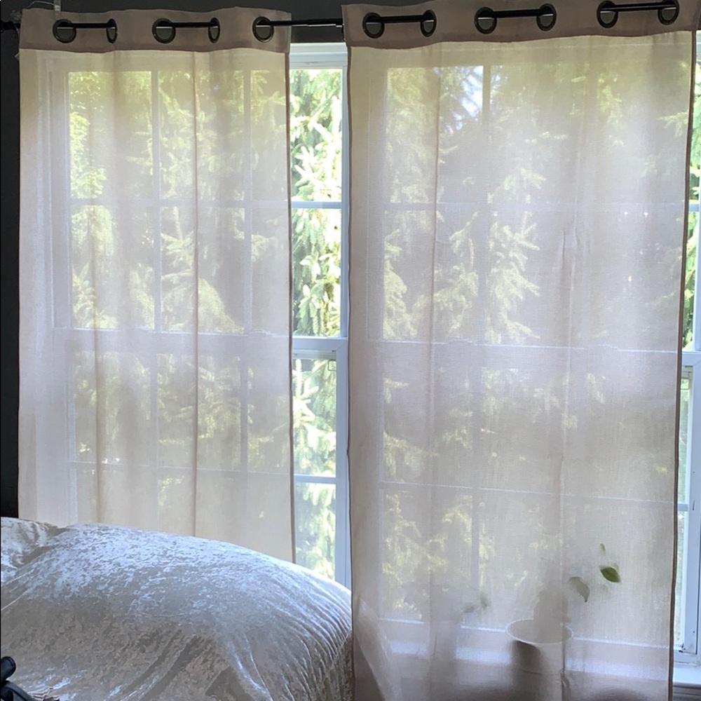 Beautiful beige sheer curtains.